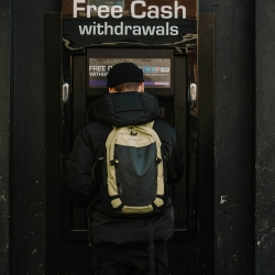 student withdrawing money from ATM