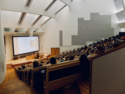 professor teaching students in lecture room